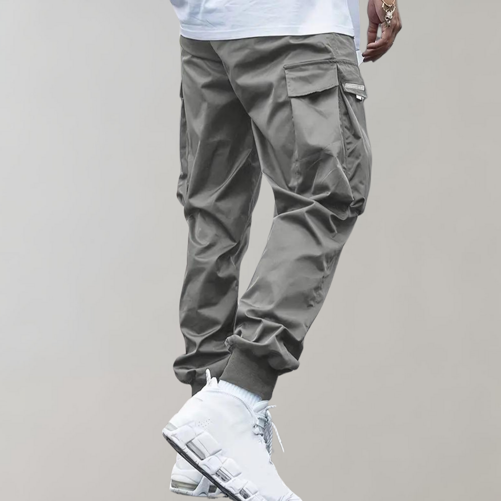 Sommerfeld™ | Herren Cargo Jogginghose – Lila Streetwear-Hose mit Reißverschlusstaschen & Bündchen